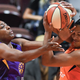 Los Angeles Sparks’ Nneka Ogwumike (left) and Connecticut Sun’s Alyssa Thomas, fight for a rebound during a contentious Game 2 of a WNBA playoff game, Sept. 19, 2019 in which the Sparks suffered a major loss. Now, the WNBA is looking into Sparks general manager Penny Toler’s locker room behavior after that game.